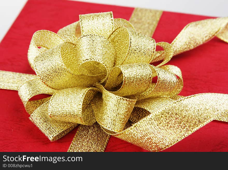 Red gift box with ribbon.