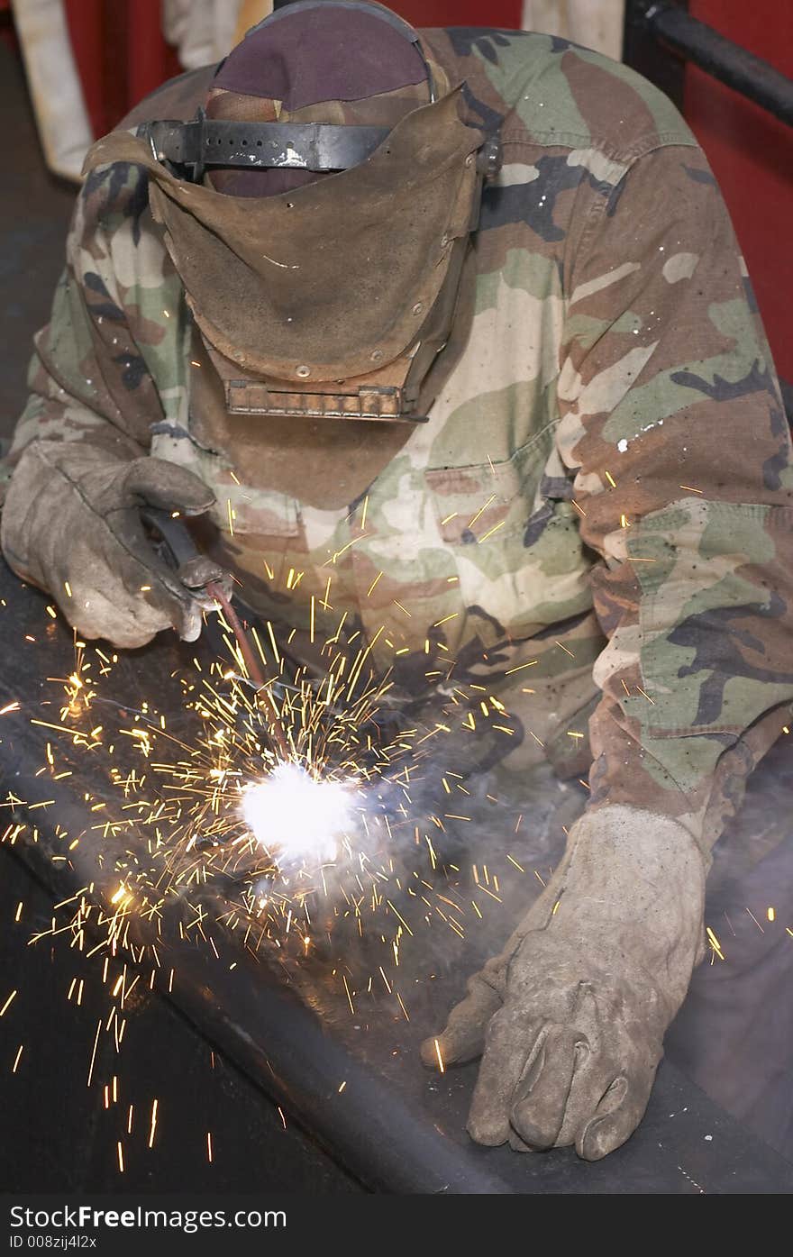 Welder working at night at shipyard. Welder working at night at shipyard