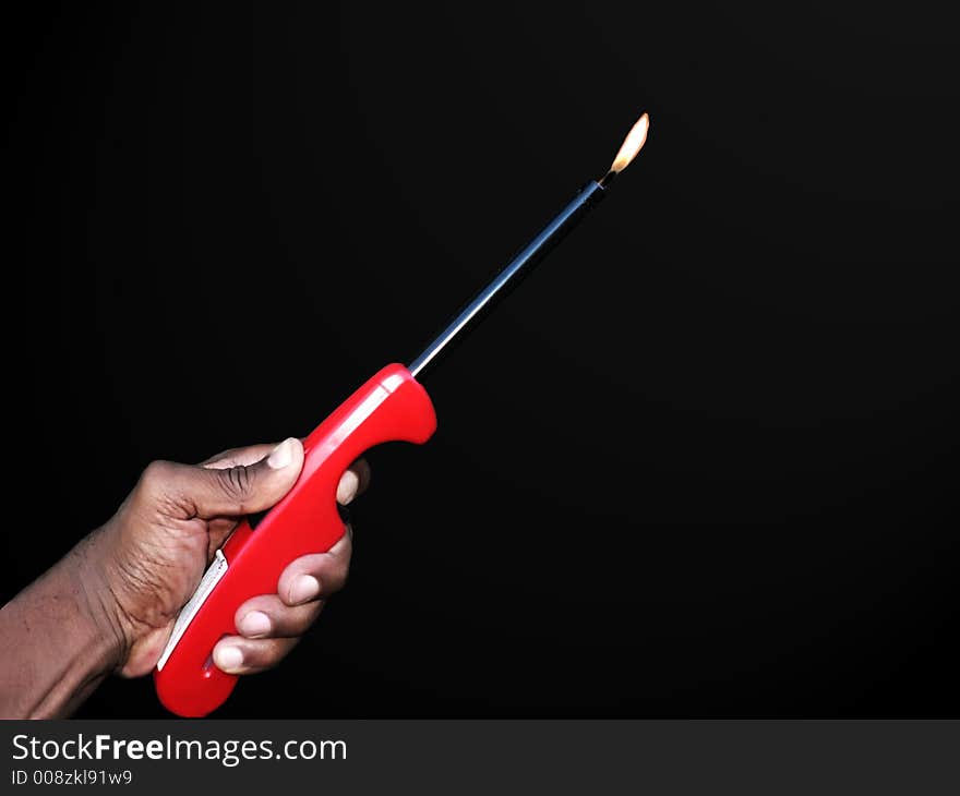 Hand holding a lighter isolated by a clipping path