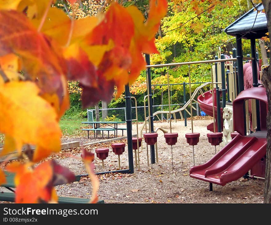 Playground in a park in October; colorful leaves. Playground in a park in October; colorful leaves.