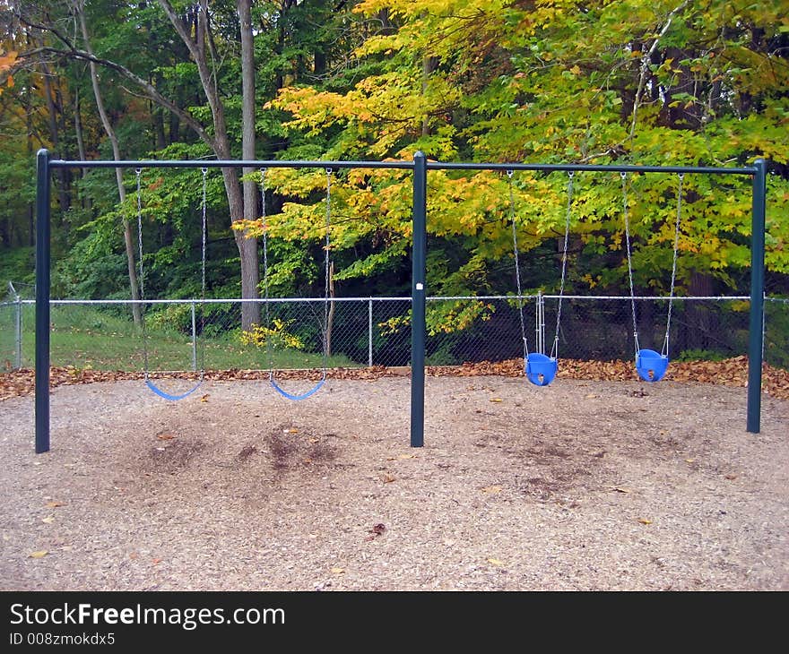 Swingset in a Park in the Autumn. Swingset in a Park in the Autumn