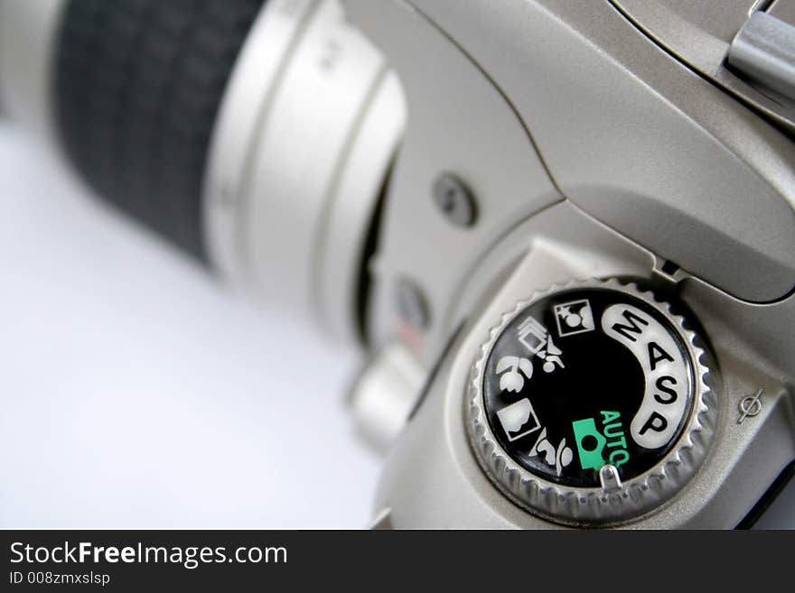 SLR photographic camera isolated over white background. SLR photographic camera isolated over white background