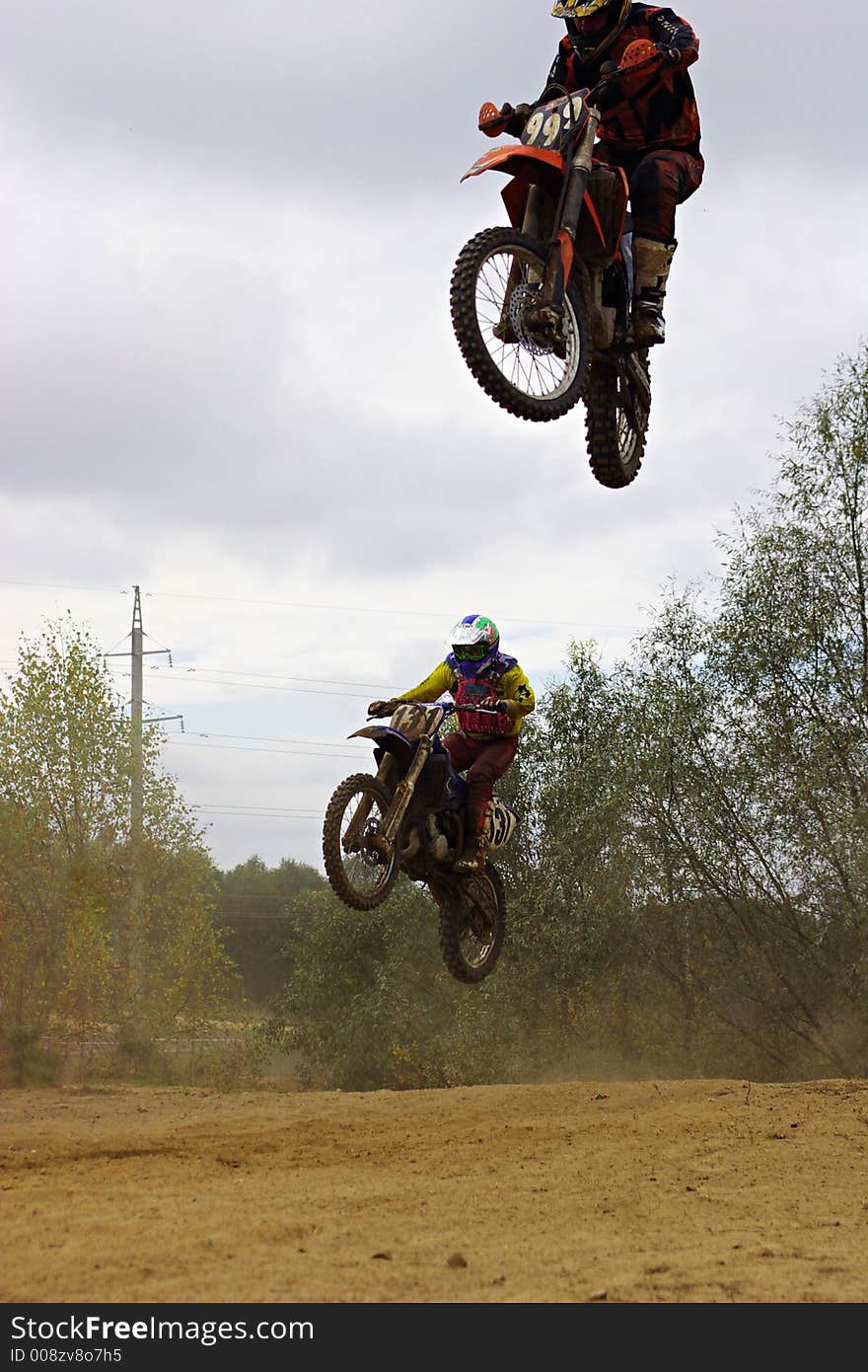 Two jumping bikers. Motor race.