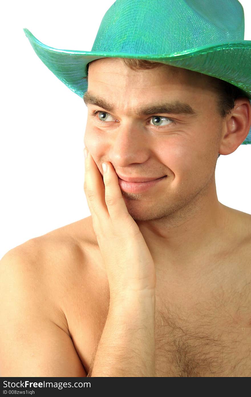 Man in green hat is smiling. Man in green hat is smiling