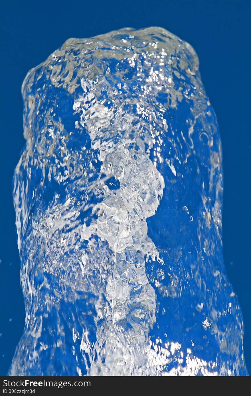 Water splash against a blue backdrop.