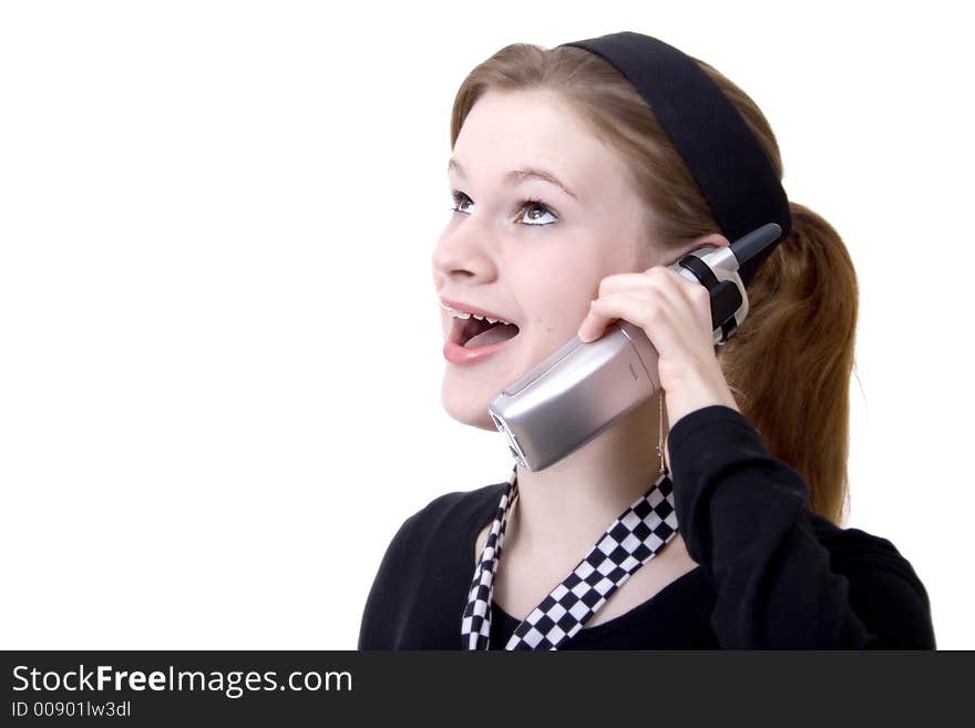 Attractive teen smiling and talking on the phone. Attractive teen smiling and talking on the phone.