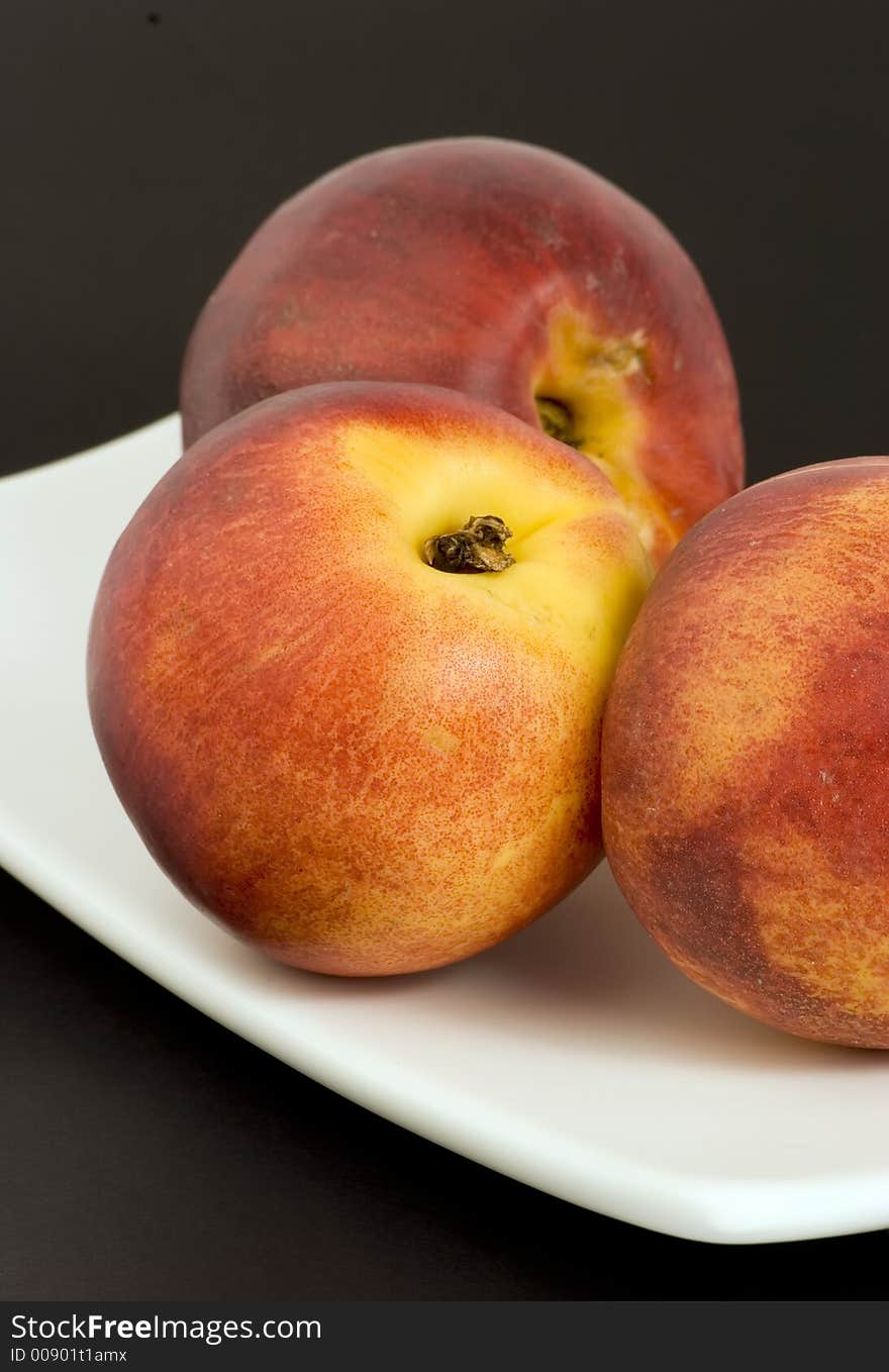 Nectarines on plain background, Studio shot.