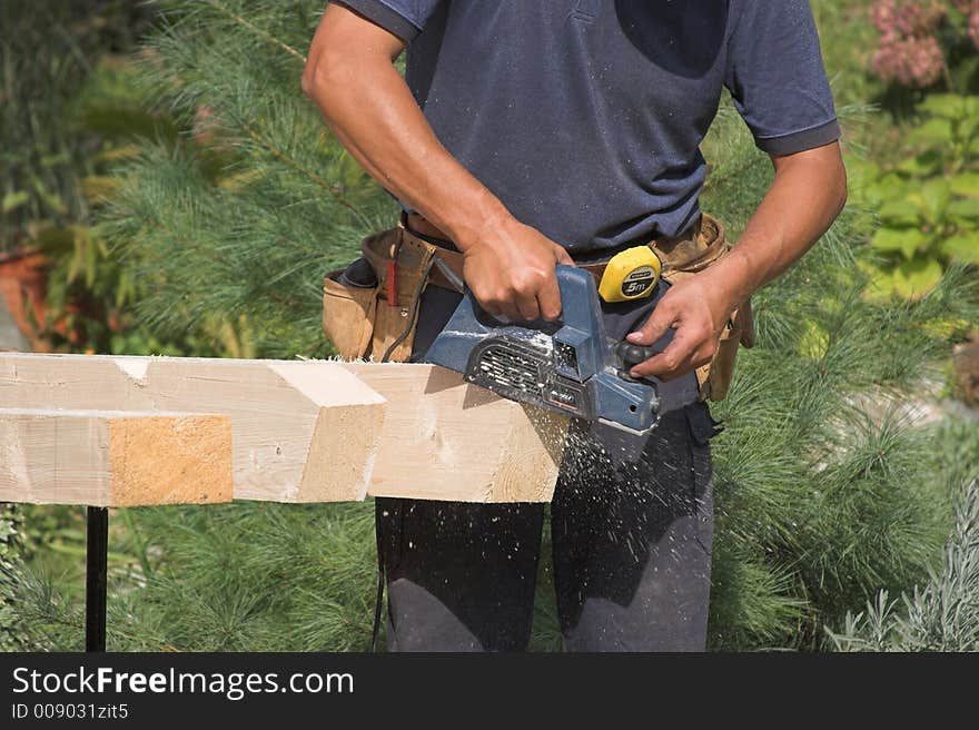 Working carpenter. Preparing elements for roof construction. Working carpenter. Preparing elements for roof construction