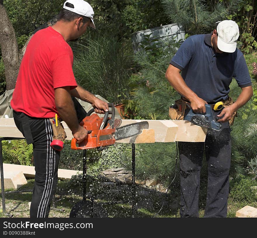 Working carpenter. Preparing elements for roof construction. Working carpenter. Preparing elements for roof construction