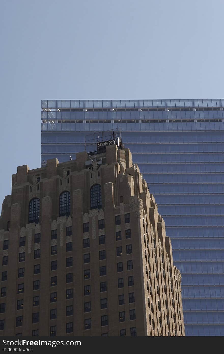 Historical office building in front of a modern skyscraper. Historical office building in front of a modern skyscraper