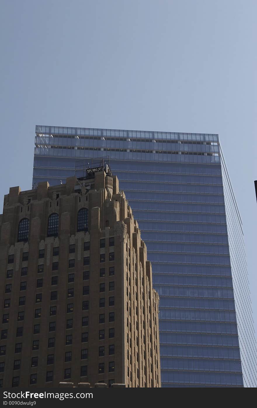 Historical office building in front of a modern skyscraper. Historical office building in front of a modern skyscraper