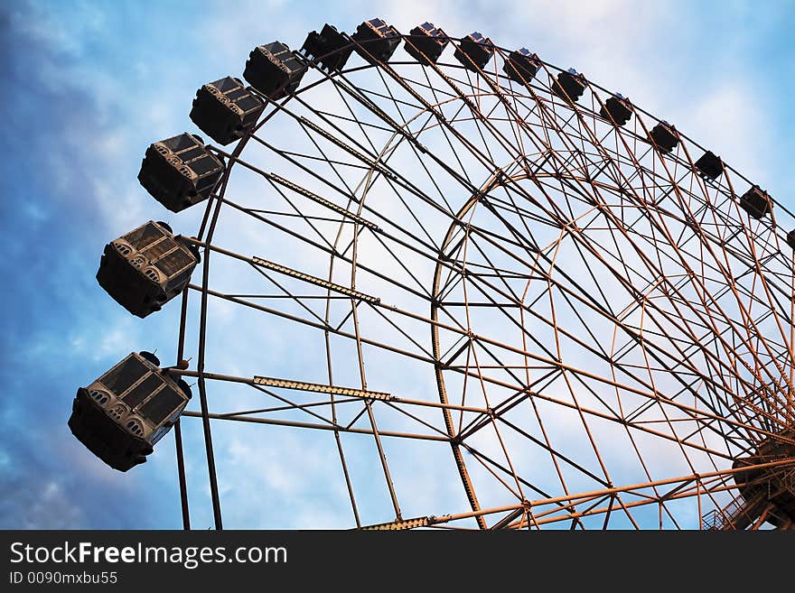 A ferris wheel at an amusement park. A ferris wheel at an amusement park