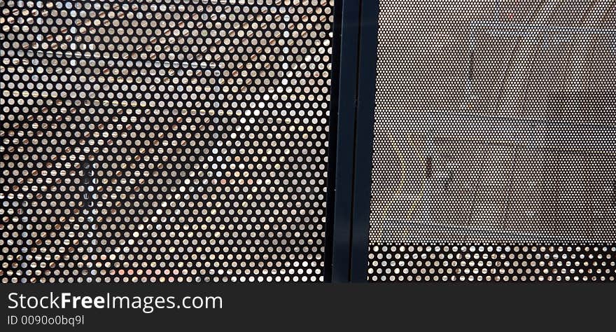 Melbourne railway tracks seen through a steel grille