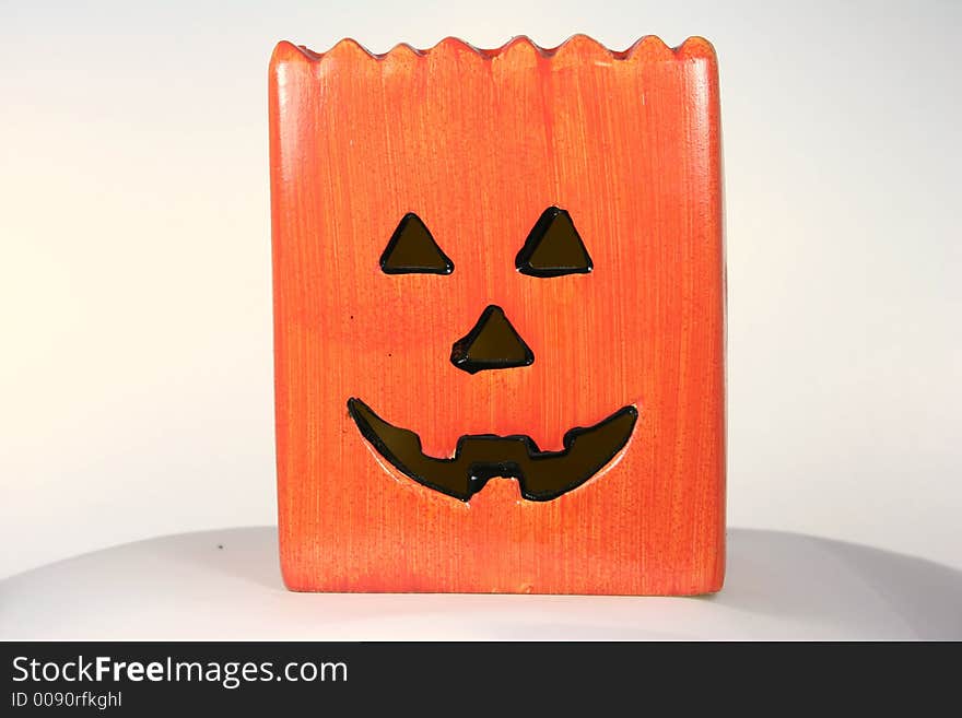 Orange pumpkin candle holder