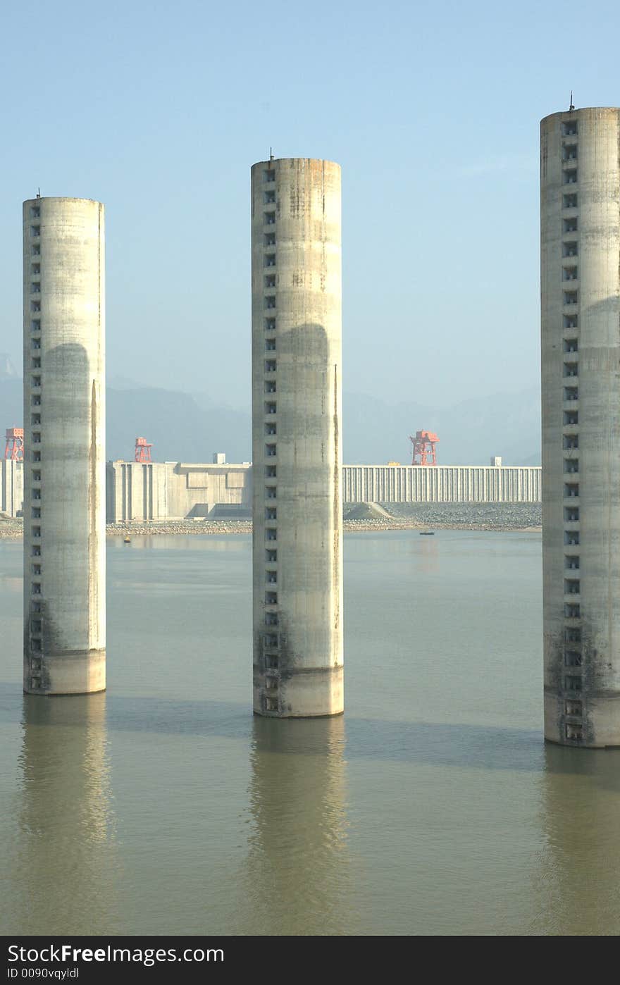 Mooring stations for boats waiting to enter the ship locks of the Three Gorges Dam (in the background). Mooring stations for boats waiting to enter the ship locks of the Three Gorges Dam (in the background).