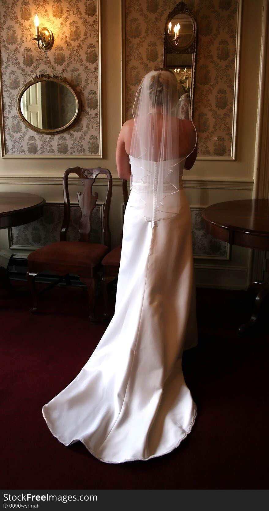 Dressed up bride having a quiet moment before wedding