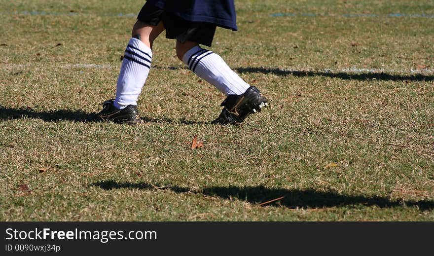 Boy running during soccer practice