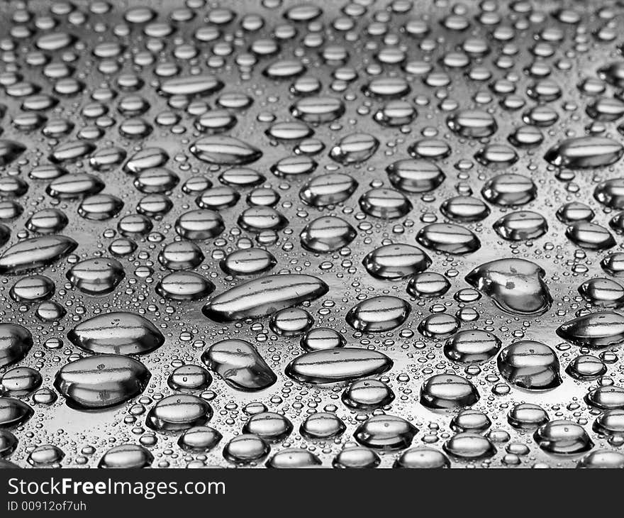 Water drops on a silver surface. Water drops on a silver surface