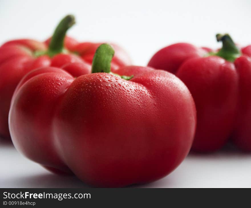 Three fresh red tomato peppers