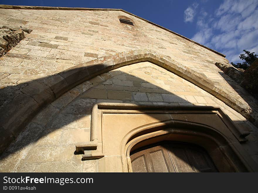 A beautiful ruined but still consecrated church in England under late afternoon sunlight and a blue sky with some clouds. A beautiful ruined but still consecrated church in England under late afternoon sunlight and a blue sky with some clouds