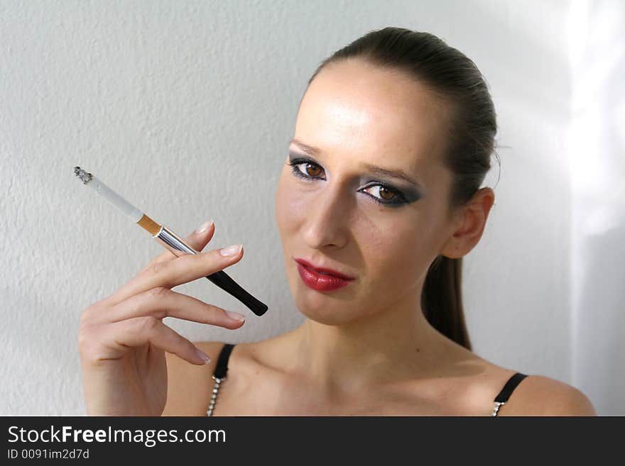 A Shot of a girl smoking outdoor. A Shot of a girl smoking outdoor