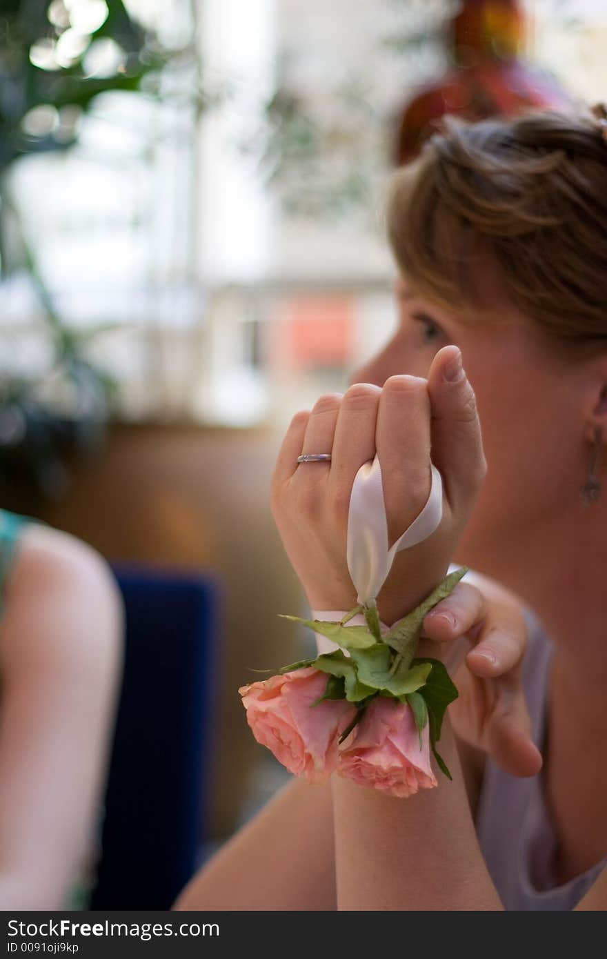 A bride with flowers tied to her hand. A bride with flowers tied to her hand