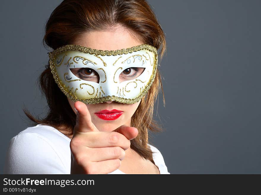 Brunette with mask pointing