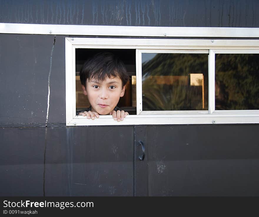 A happy boy in a horse trailer. A happy boy in a horse trailer