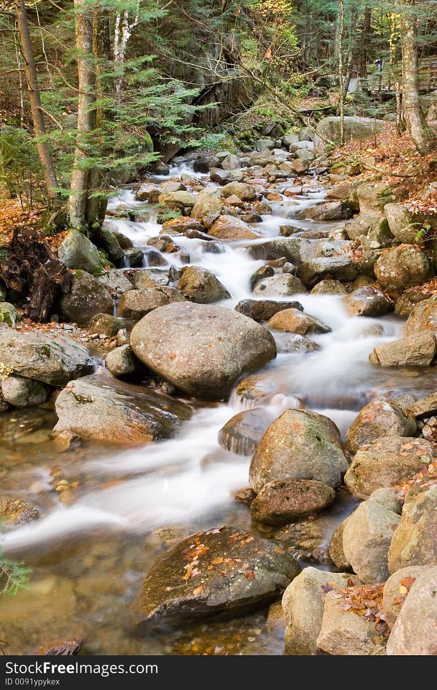 Stream running through the mountain rocks of New Hampshire. Stream running through the mountain rocks of New Hampshire.