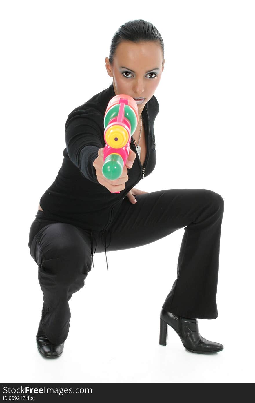 Beautiful woman in black aiming water gun. Beautiful woman in black aiming water gun.