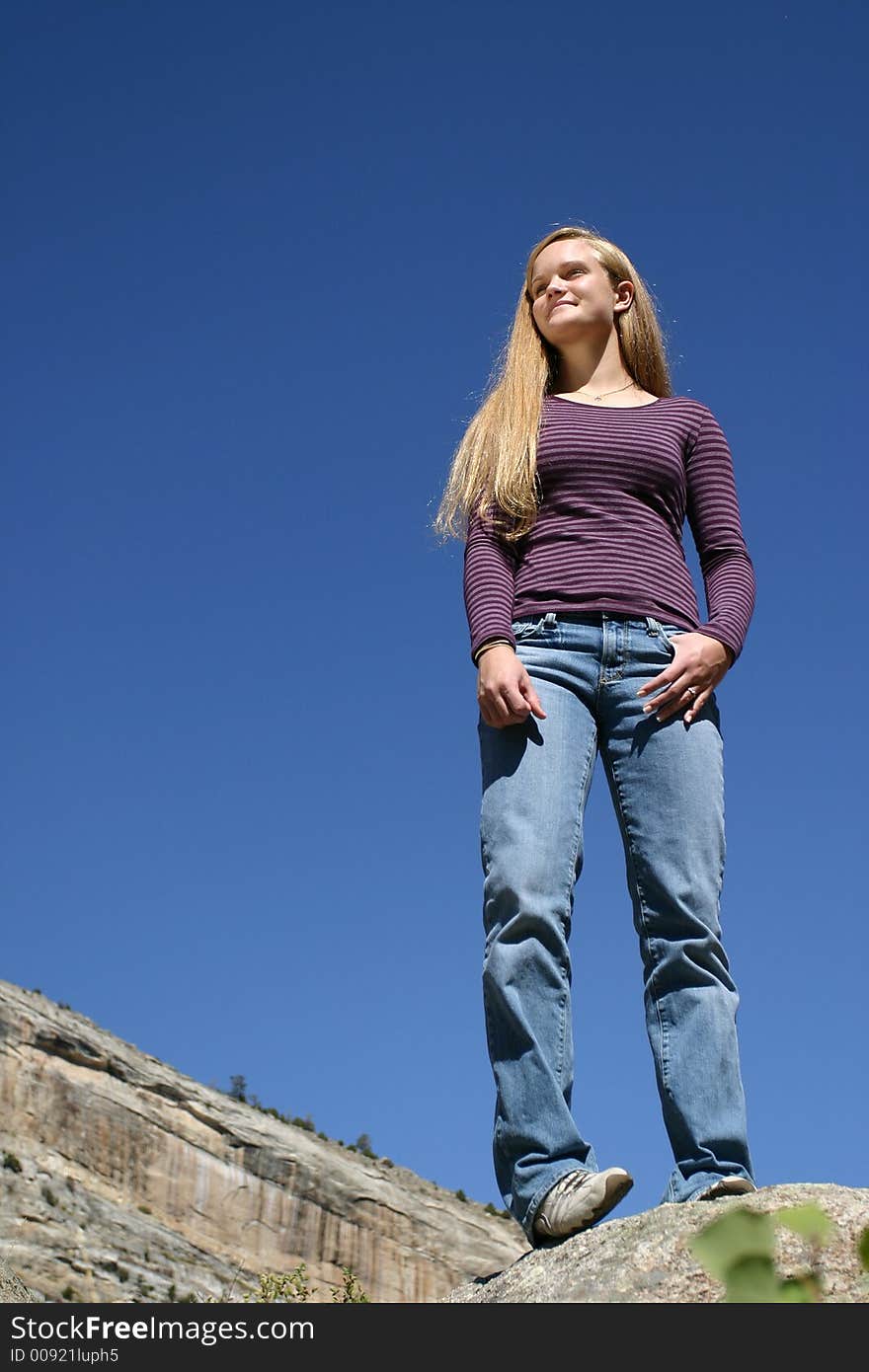 A female teenager looks ahead to the future. Nice smile, great outdoors and blue sky. Lots of room for copy too. A female teenager looks ahead to the future. Nice smile, great outdoors and blue sky. Lots of room for copy too.