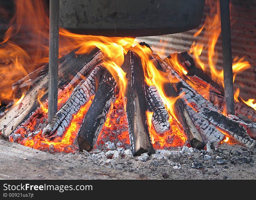 Open fire under a kettle of apple butter