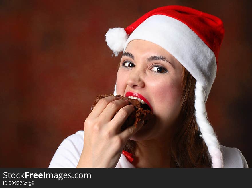 Santa girl eating cake