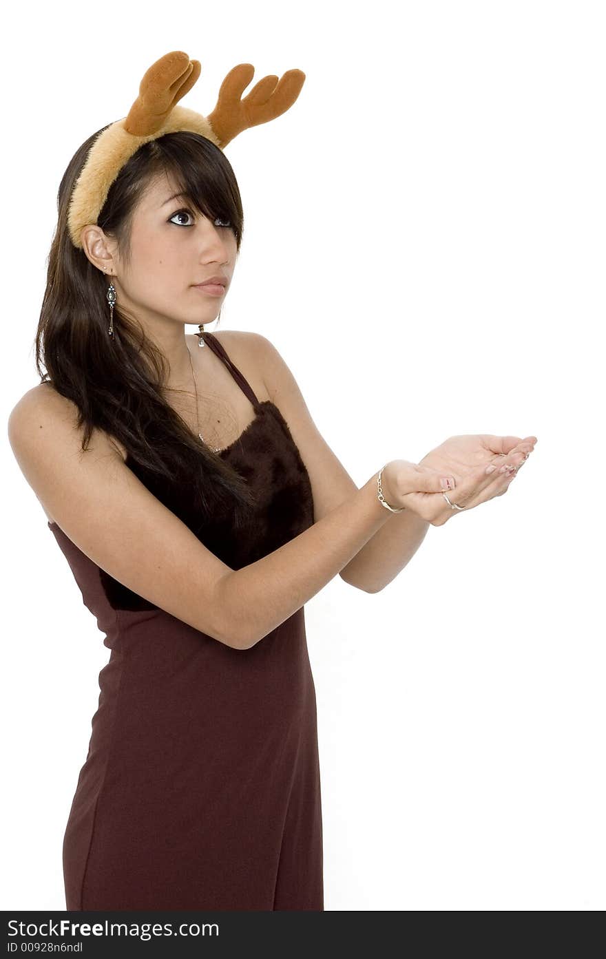 Cute Girl Holding Out Hands With Reindeer Ears On