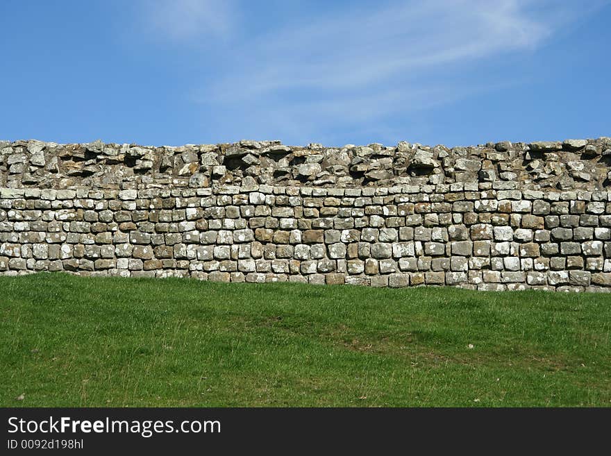 Stone Wall divides Grass and Sky