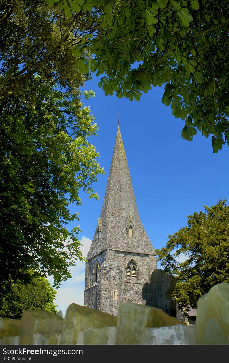 The imposing stone spire of Llanddarog Church, Dyfed, Wales, UK. This imposing Norman church is situated on a hill. Its spire is a landmark for the village and can be seen for miles. The imposing stone spire of Llanddarog Church, Dyfed, Wales, UK. This imposing Norman church is situated on a hill. Its spire is a landmark for the village and can be seen for miles.