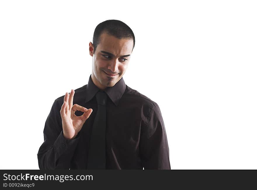 Young man of Middle Eastern ethnicity gives a confident okay gesture. Young man of Middle Eastern ethnicity gives a confident okay gesture.