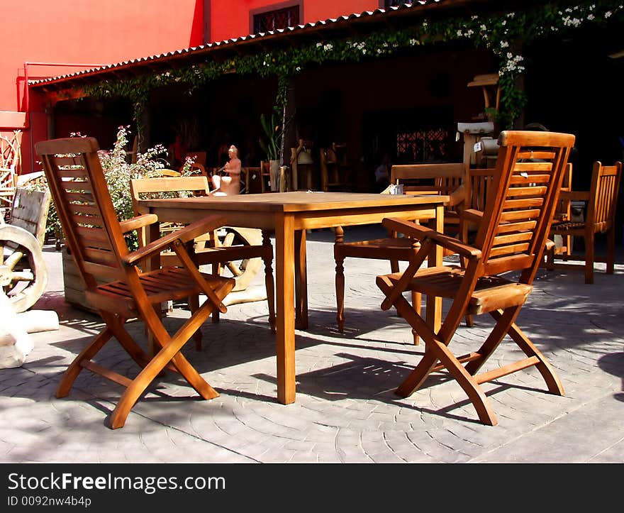 Terrace forniture on wood made. Table and chairs