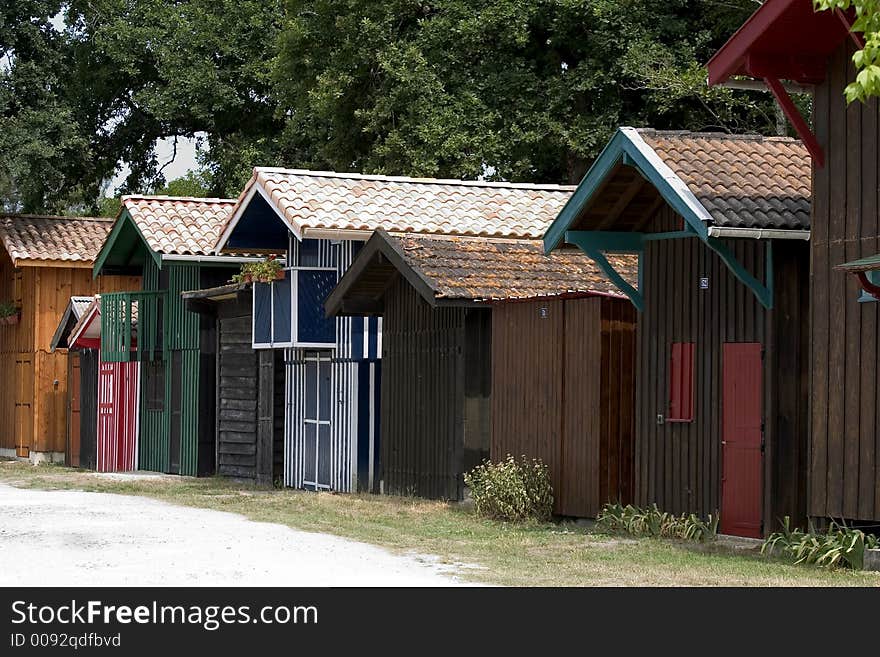 Colorful cabins in the port of Biganos, Gironde, Aquitaine, France. Colorful cabins in the port of Biganos, Gironde, Aquitaine, France