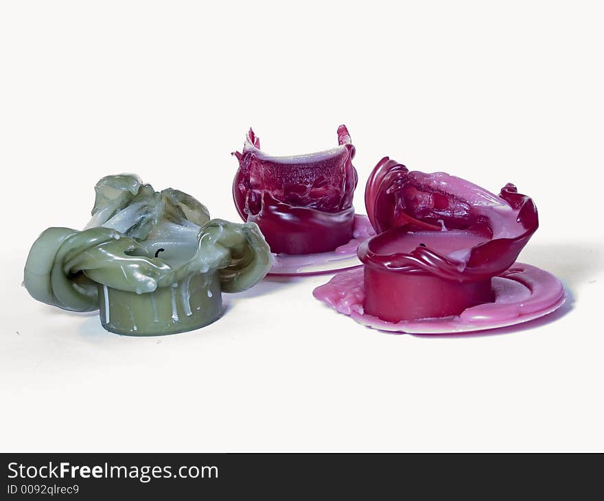 A collection of melted candles creating unique shapes.