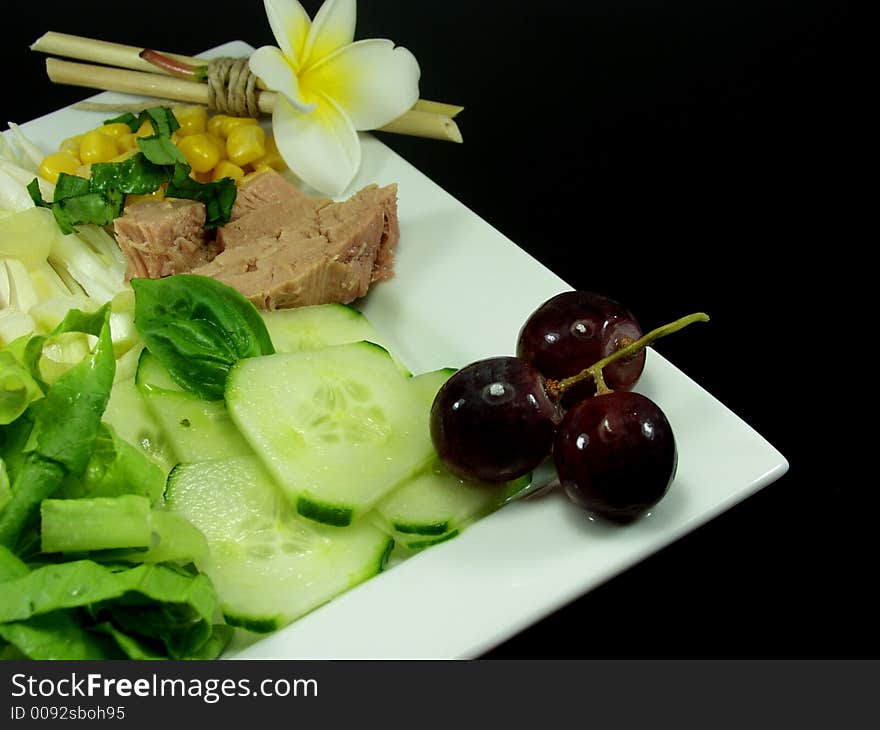 Tuna fish salad on white platter decorated whit flower. Tuna fish salad on white platter decorated whit flower