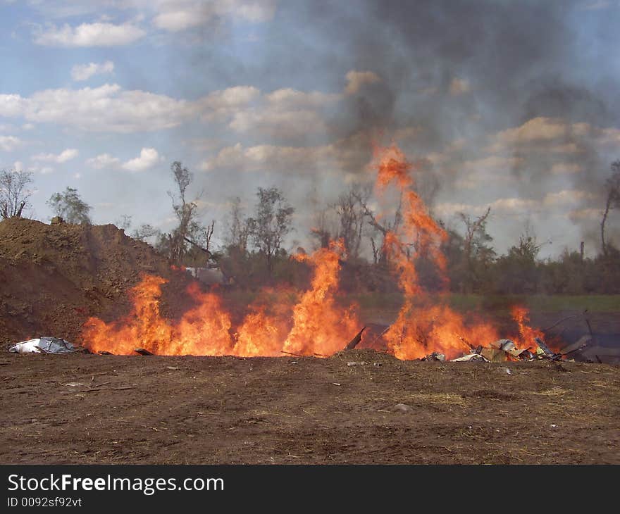 Trash burning in a pit. Trash burning in a pit