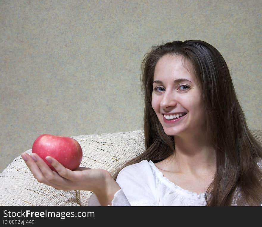 Pretty smiling woman with red apple. Portrait. Pretty smiling woman with red apple. Portrait.