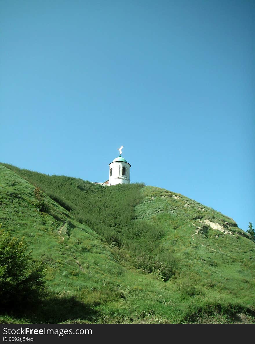 On a hill a tower with the angel above