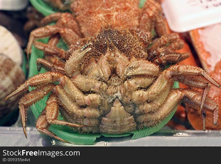 Detail of a ventral part of a crab on a seafood market stand. Detail of a ventral part of a crab on a seafood market stand.