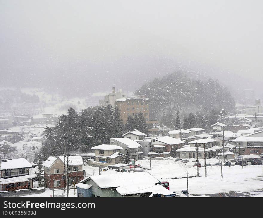 Snowfall over countryside