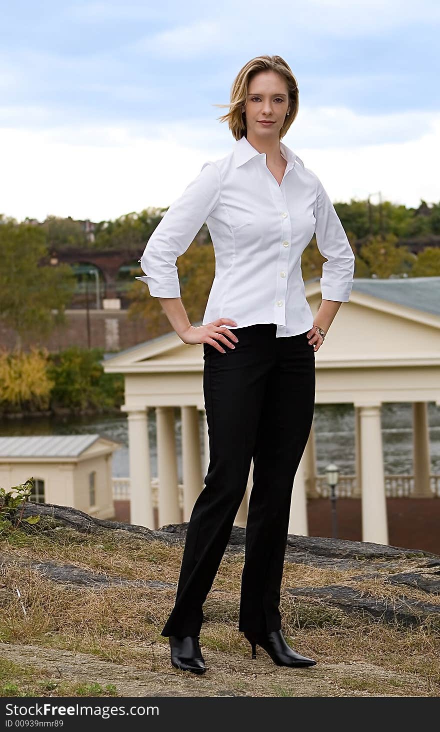 A young successful businesswomen posing outdoors. A young successful businesswomen posing outdoors.