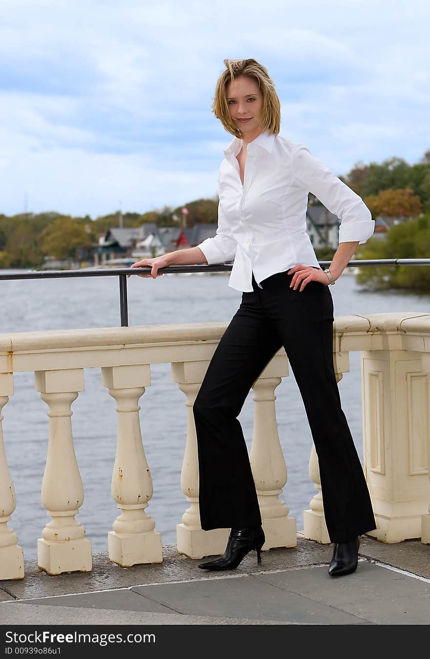 A young successful businesswomen posing outdoors. A young successful businesswomen posing outdoors.