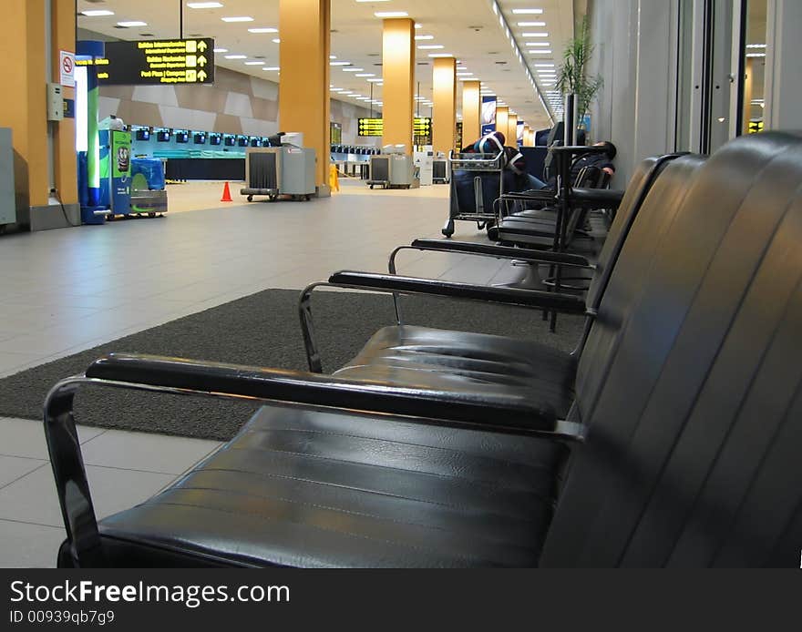 Black arm-chair in airport. Black arm-chair in airport