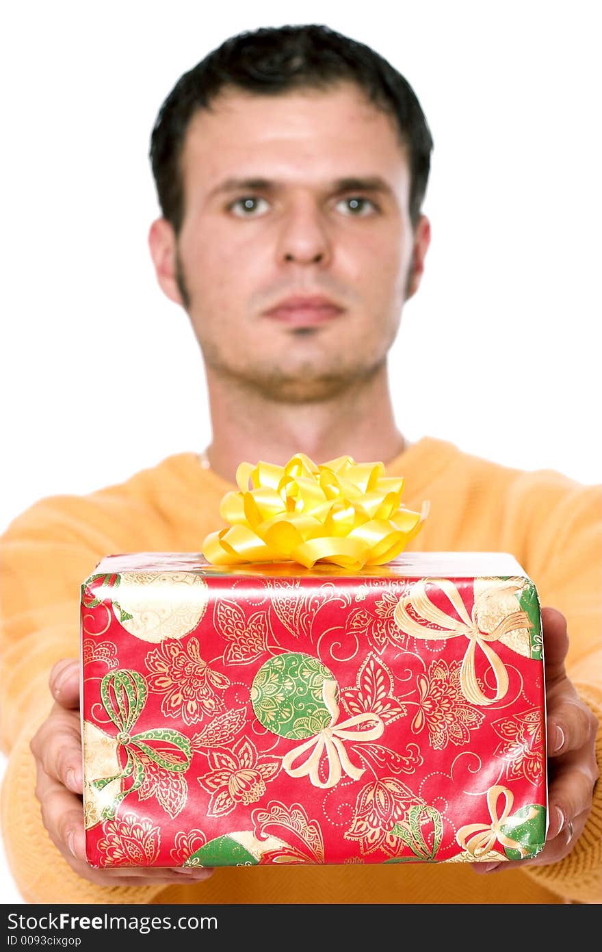 A young handsome holding a christmas present. A young handsome holding a christmas present